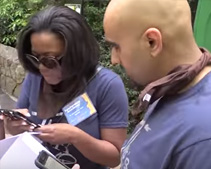 two people on their phones