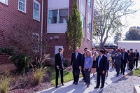 a group of community members walking near a building